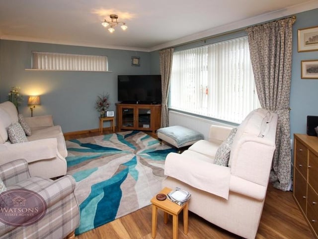 First stop on our tour of the Coppice Drive bungalow is this L-shaped lounge/dining room. It is a bright space, thanks to a double-glazed bay window facing the front of the property.