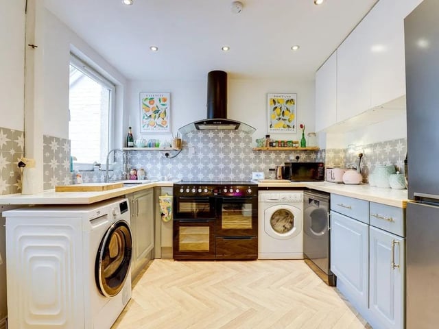 There is a modern fitted kitchen offering ample storage and workspace.