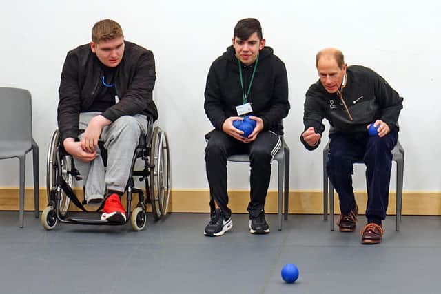 The Duke of Edinburgh having a go at Boccia in the new sports hall.
