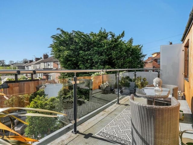 The impressive glass balcony to the master bedroom is one of the highlights of the property. It boasts wood cladding and a seating area, plus superb views of the Selston countryside.