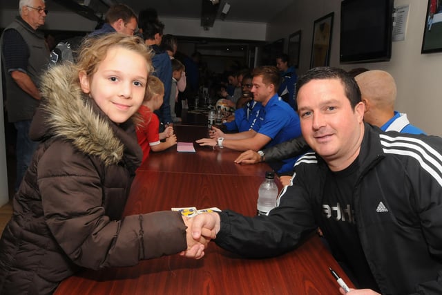Emily Allsop shakes hands with manager Paul Cox