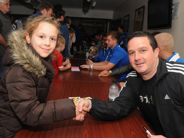 Emily Allsop shakes hands with manager Paul Cox