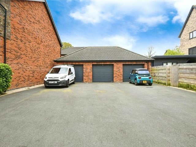 More parking space is available on a tarmac driveway at the back of the property, leading to an adaptable garage, with an electric door and equipped with power and lighting. The garage has been divided into two, with one part used for storage and the second capable of being converted into an extra living space or a home office