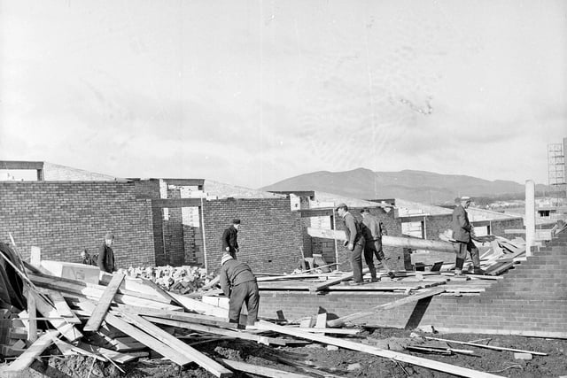Workmen clear wreckage at Hyvots Bank following storms in May 1964.