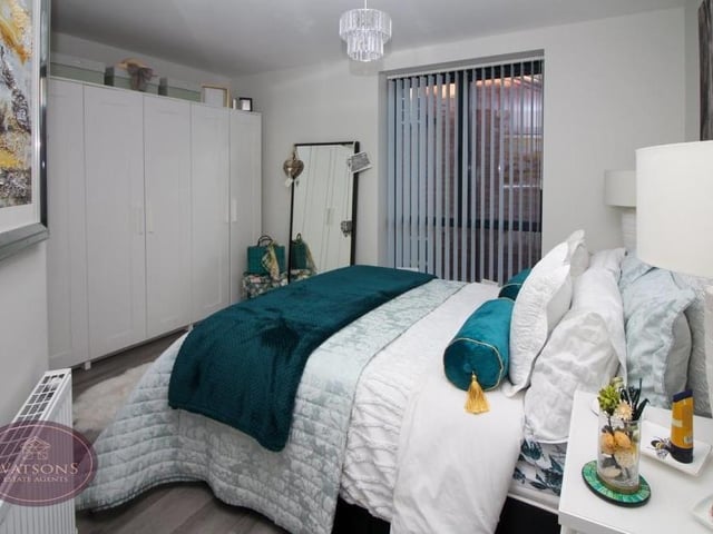 On the second floor is this primary bedroom, which has a double-glazed window to the front of the house, as well as luxury vinyl tiled flooring.