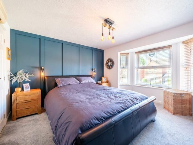 The master bedroom looks a treat, especially with its large bay window overlooking the front of the £425,000 house. It is generously proportioned, with ample fitted storage space and access to an en suite bathroom.