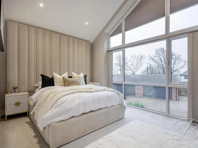 One of five luxury bedrooms in the spacious home.