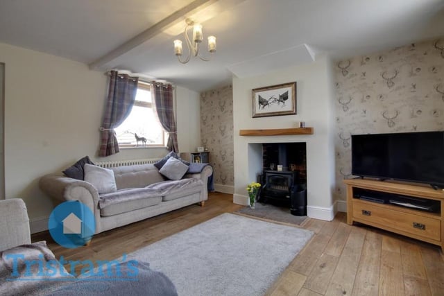 As we begin our tour of the Ollerton cottage, let's step directly into the living room. A comfortable space in which to relax, it has lots of natural lighting, thanks to uPVC windows at the front and back of the property.