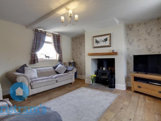 As we begin our tour of the Ollerton cottage, let's step directly into the living room. A comfortable space in which to relax, it has lots of natural lighting, thanks to uPVC windows at the front and back of the property.