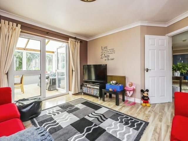The second reception room on the ground floor is this delightful dining room, which is blessed with Pergo laminate flooring, coving to the ceiling and double doors that lead directly into the conservatory.