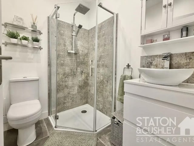 The master bedroom benefits from a luxury en suite shower room finished with high-quality fixtures and fittings.