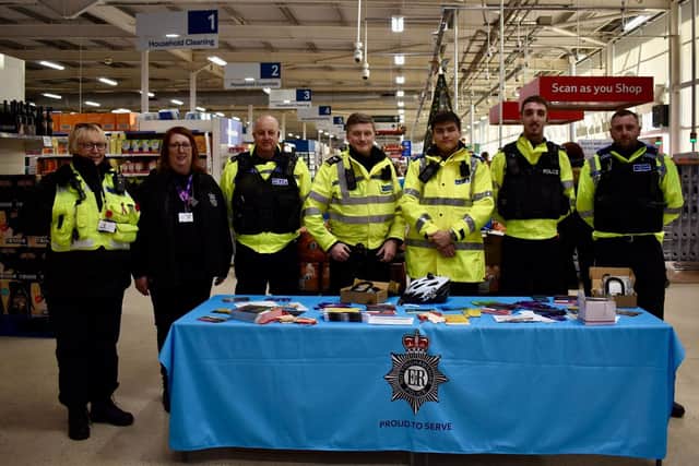 Police officers at a previous day of action in Tesco Extra, Oak Tree.