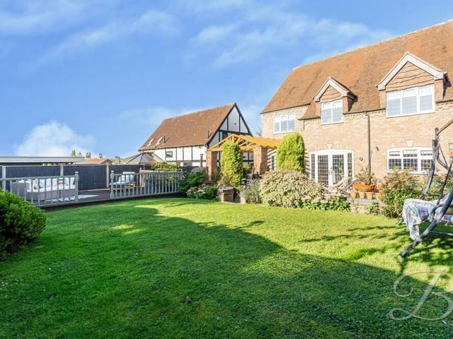 A well-maintained lawn, shrubbery, plants and trees complete the rear garden, which provides a tranquil oasis, especially during the summer.