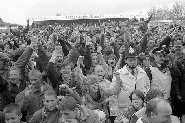 Fans celebrate promotion.