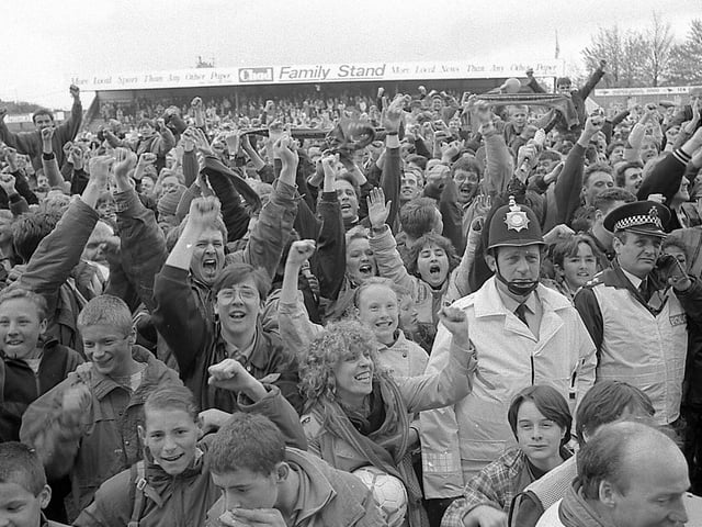 Fans celebrate promotion.