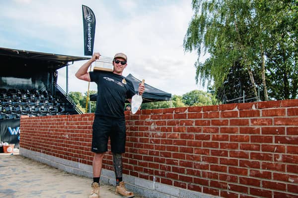 A jubilant Dale next to his award-winning wall
