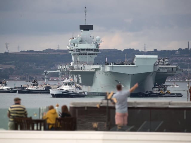 The Royal Navy aircraft carrier HMS Queen Elizabeth leaves Portsmouth. Picture: Andrew Matthews/PA Wire