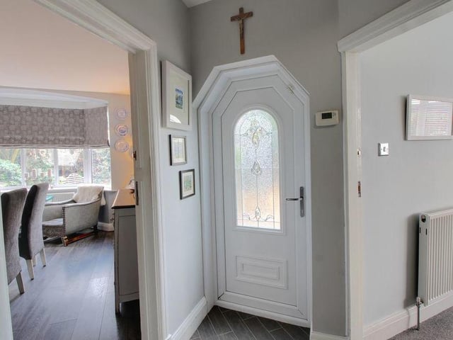 The pleasant entrance hall leads to the dining room and the lounge, as well as the stairs, plus a ground-floor WC and cloakroom..