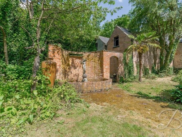 At the bottom of the rear garden is an old coach house, which adds to the character of the fascinating Mansfield property.