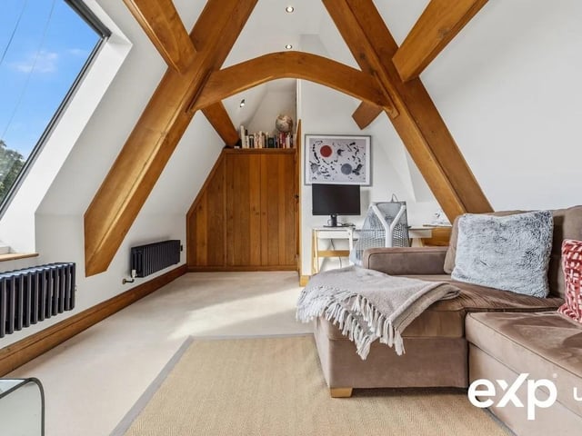 Occupying the entirety of the top floor the third bedroom boasts a vaulted ceiling and fantastic exposed beams
