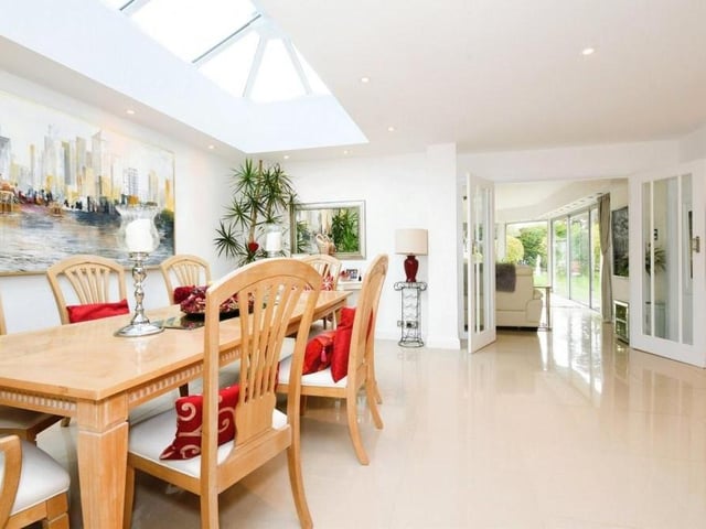 Hovering above the dining table is this striking skylight, fitted to the roof. One of many terrific touches that can be found throughout the Mansfield bungalow.