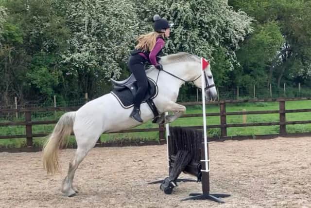 Alyssia enjoys her riding lesson.