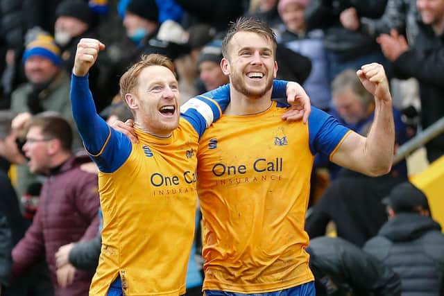 Team mate Stephen Quinn celebrates with Mansfield Town forward Rhys Oates after he scored the equalising goal. Picture by Chris Holloway/The Bigger Picture.media