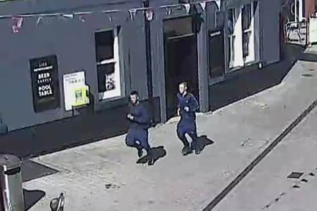 Police want the public's help to find these two men after a 13-year-old boy was robbed in Kirkby. Photo: Nottinghamshire Police