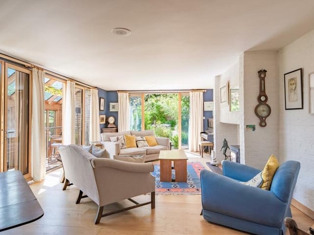 The stylish sitting room at the £1.5 million Southwell property has access to a balcony or roof terrace.