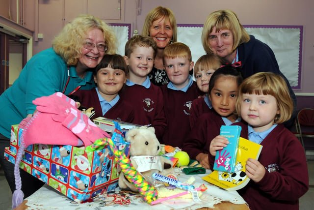 Back to 2013 and this scene shows Samaritans Purse International Shoebox Appeal district co-ordinator Carol Hall, left, with St Bede's RC Primary School headteacher Moya Rooney, centre, and Tricia Octon, with pupils. Does it bring back happy memories.