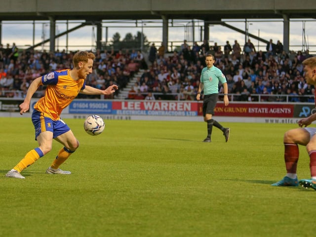 Stephen Quinn looks to get past his man.