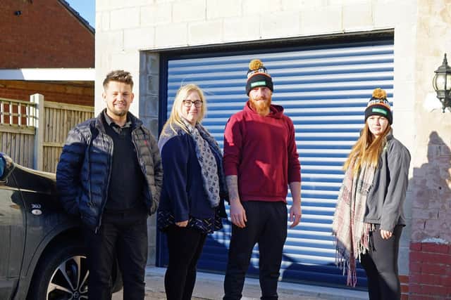 Pictured outside the property is Andy Brewster, community DIY, and project manager Kerry Hallbrook, alongside homeowner Keith Newell and Joanna Simpson from Huws Gray.