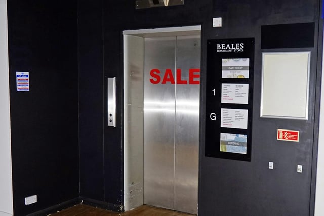 A sale banner remains on one of the elevators.
