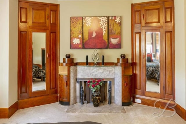 Nowhere is the property's sense of grandeur more exemplified than in the master bedroom, which features this original, Italian fireplace, made of marble and walnut.