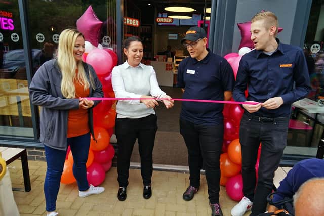 Opening of new Dunkin' donuts. Seen at the ribbon cutting, Alicia Timmins, Linda Marshall, Josh Ilkeston and James Guy.