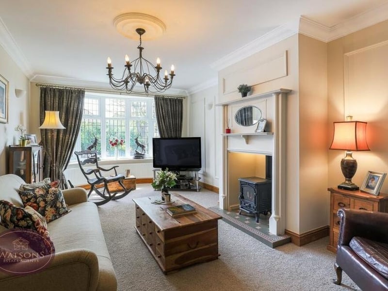 This lovely lounge sets the tone for the rest of the £700,000 Jacksdale property. A large, double-glazed bay window at the front of the property injects lots of natural light, while a feature fireplace, with an inset gas multi-fuel burner, adds style.