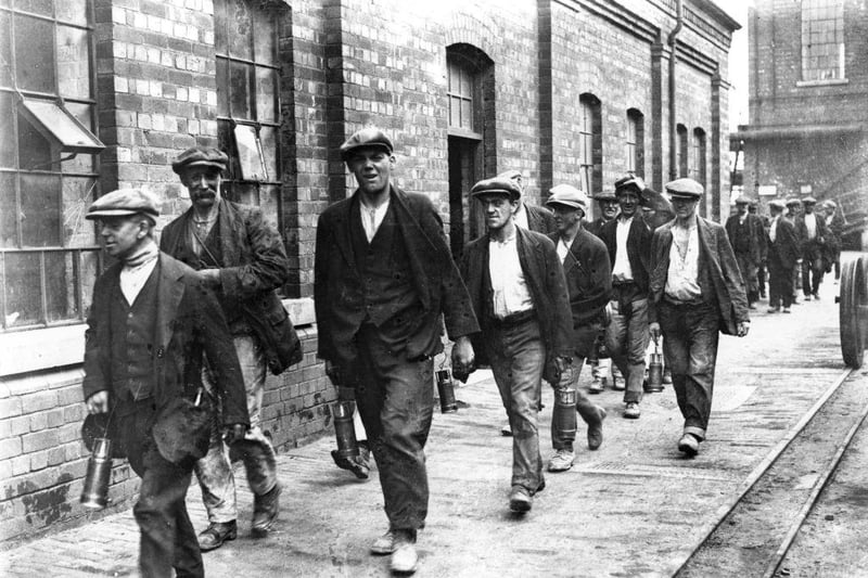 1st August 1926:  Miners from the colliery at Crown Farm near Mansfield, Nottingham on their way home from work.  (Photo by Central Press/Getty Images):f