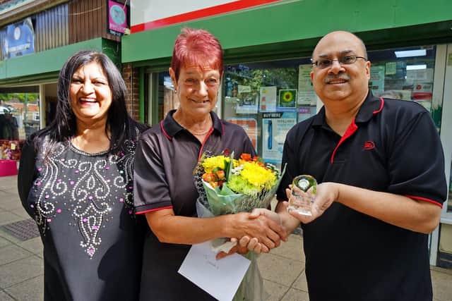 Staff member, Yolanda Cassidy celebrates 25 years of service. Pictured: Alka Bhatt, Yolanda Cassidy and Kalpesh Bhatt.