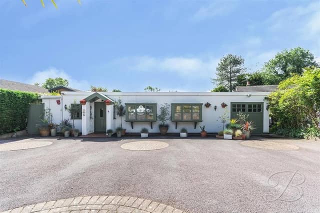 Low maintenance frontage with a driveway and garage, providing off-street parking.