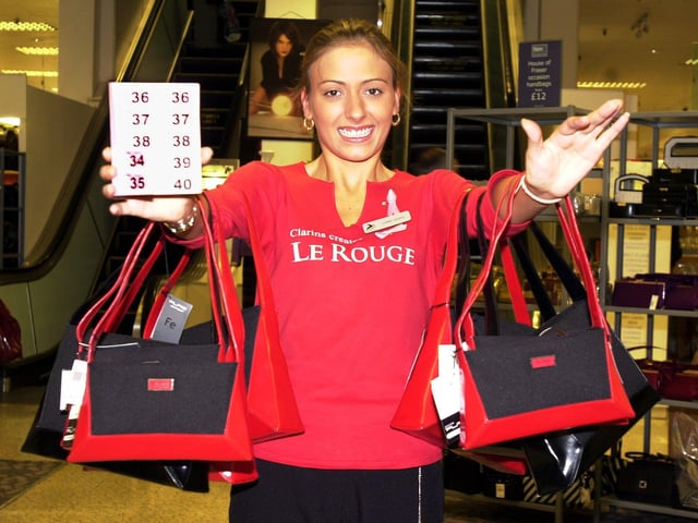 Binns worker Joanne Rourke, aged 22, helps raise funds during Breast Cancer Awareness Month in 2001
