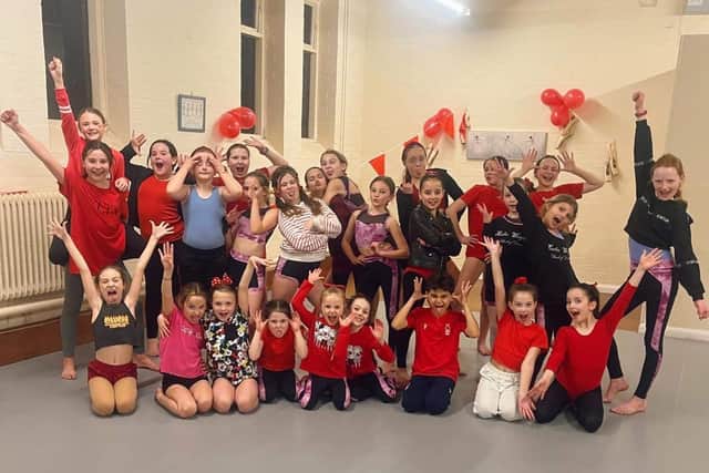 Dancers at the Katie Wright School of Dance all dressed in red for the cause.