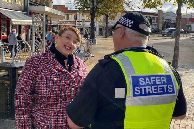 Police and Crime Commissioner Caroline Henry speaks with a Safer Streets warden 