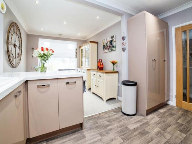 This how the kitchen diner looks as you enter from the hallway door to the right. It is a terrific size, and leads into a dining area, as you can see here.