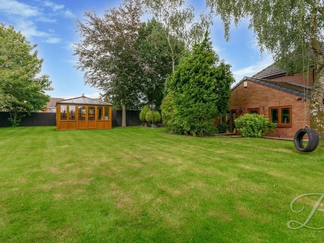 The rest of our photo gallery is devoted to the £725,000 property's expansive garden, which spans 800 square feet. Among its attractions are lush lawns and a range of mature shrubs and trees.