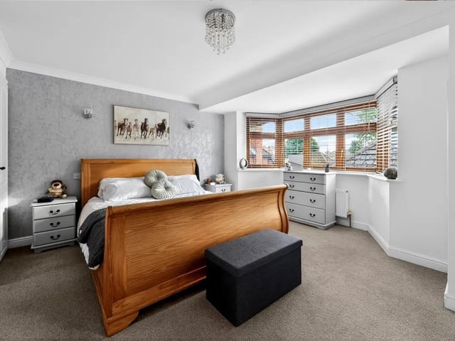 The principal bedroom benefits from its own en-suite shower room and fitted wardrobes.
