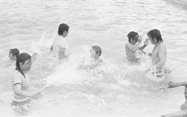 Residents splashing around in 1981. Remember this pool?