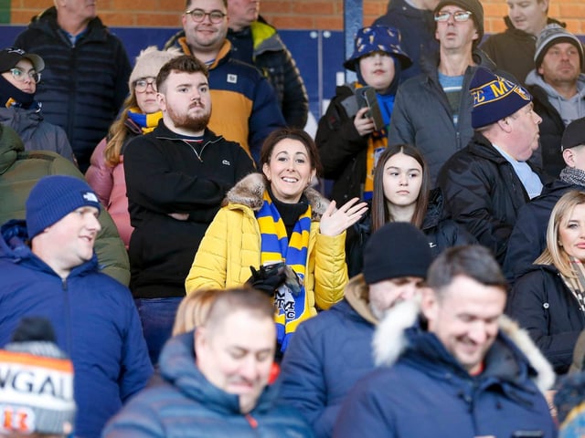 Mansfield Town fans enjoy the win at Stockport County