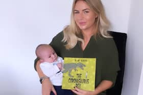 Jade Topliss  with seven week old Walter and her book Coronasaurus Rex  - Jade Topliss