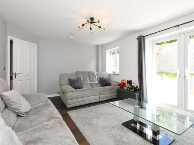 Our tour of the Sutton property begins in this smart and light lounge. The French doors lead to the back garden.