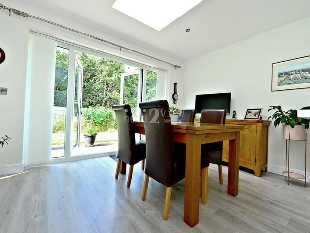 Beyond the dining area are uPVC double-glazed patio doors that lead out to the garden.